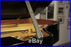 Rebuilt, 1970 Steinway Model A grand piano with a black case and spade legs