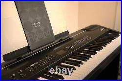 Roland FP-7 Digital Piano with stand, hold pedal, music stand & flight case