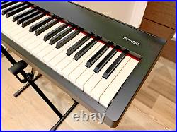 Roland FP30 Digital Piano, with dust cover, stand, and carry case