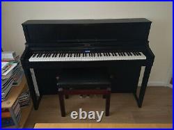 Roland LX-7 Digital Piano. Black wooden case. Fully adjustable Stool