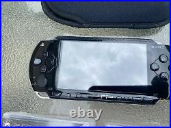 Sony PSP-1001 Black Handheld Portable Playstation System with 2 New Games & Case