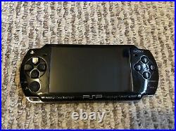 Sony PSP 2000 Black With Charger, Hard Case, 4GB Memory, And 5 Games The Warriors