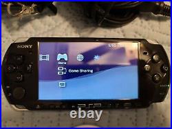 Sony PSP-3000 Softmoded + 7 UMD games + Two Memory Cards + Charger and Case