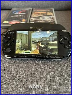 Sony PSP-3003 Black Console. Includes Case, Games & Charger