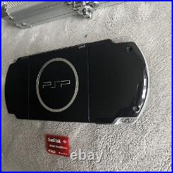 Sony PSP-3003 Piano Black Console With Case, Charger, Memory Card And 4 Games