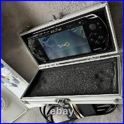 Sony PSP-3003 Piano Black Console With Case, Charger, Memory Card And 4 Games