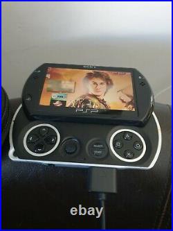 Sony PSP Go 16GB Handheld System Black. With Games, Case And Charger