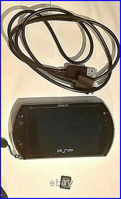 Sony PSP Go 16GB Handheld System Piano Black with case, charger + 2GB Sony M2 Car