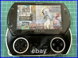 Sony PSP Go Piano Black Handheld System + 15 Games + Sony Charger + Travel Case