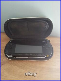 Sony PSP Piano Black With Charger And Bag + hard case inc. 3 films and 2 games