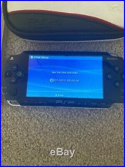 Sony PSP console 1003 piano black with 6 games, case and power supply (2)