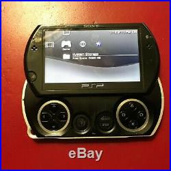 Sony PSP go 16GB Piano Black Handheld System With Charger, and Case
