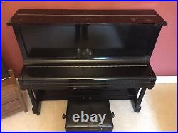 Upright Piano Serviced & Fully Working. Black wooden case with metal pin block