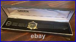 Vintage Gruen 415, exquisite piano black dial and gold plated scalloped case