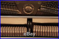 Yamaha LX-113 upright piano with a black case and walnut detail. 3 year warranty